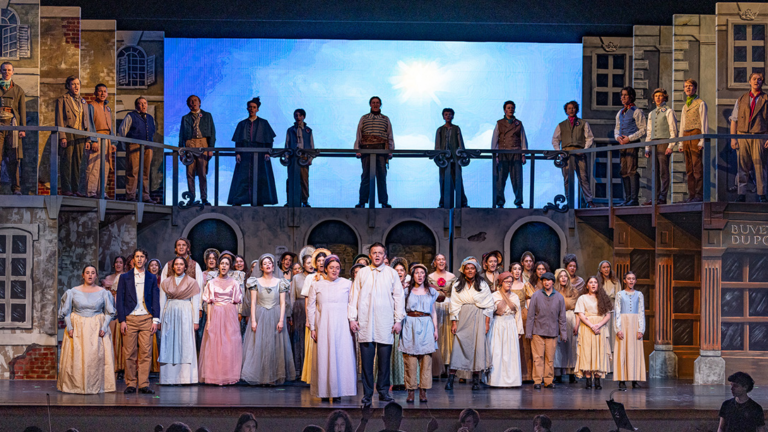 Performance of Les Misérables at Darien High School. A LED videowall serves as a backdrop.